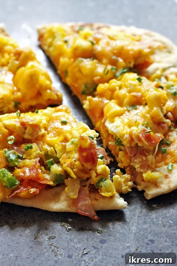 Quick Tortilla Breakfast Pizza 6 Finished breakfast pizza, fresh from the oven, with melted cheese and golden edges.