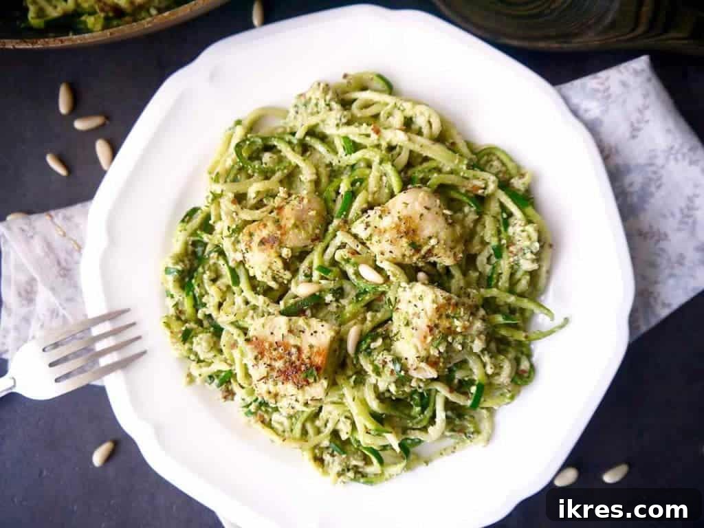 Vibrant Paleo Chicken and Zoodles with Green Pepper Almond Pesto 7 Overhead shot of the finished Paleo Green Pepper and Almond Pesto Zoodles & Chicken, showing the vibrant colors and appealing texture of the meal.
