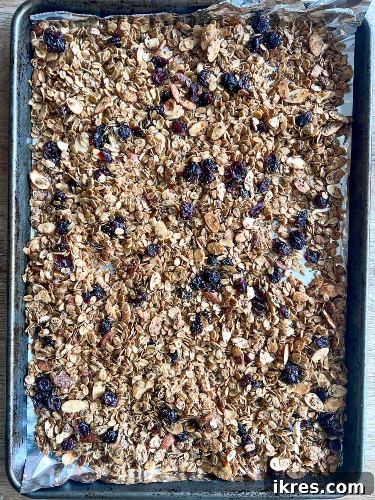 Granola with almonds and chia seeds after baking, golden and crispy.