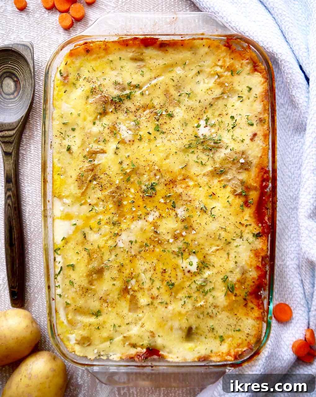 The full pan of healthy paleo shepherd's pie with ground lamb, glistening and ready to be served.