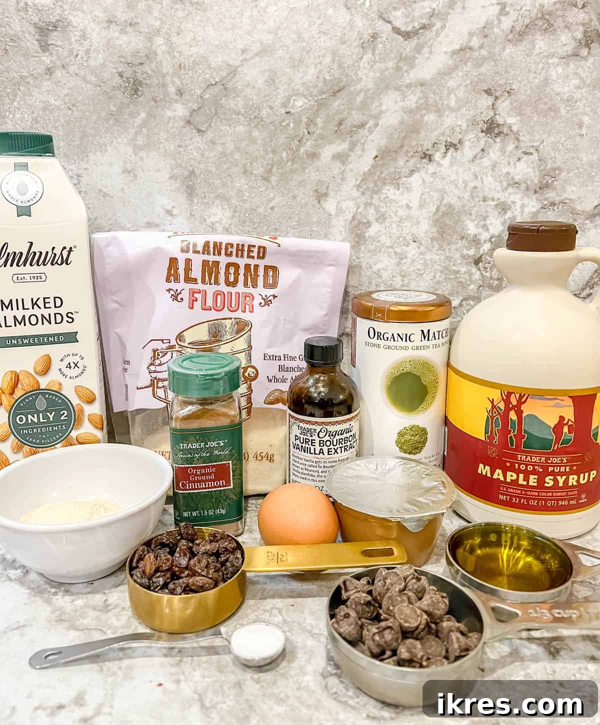 Almond Flour Matcha Brownies: A Paleo, Gluten-Free & Dairy-Free Delight 4 A collection of fresh ingredients laid out, including almond flour, coconut flour, matcha powder, eggs, maple syrup, olive oil, and chocolate chips.