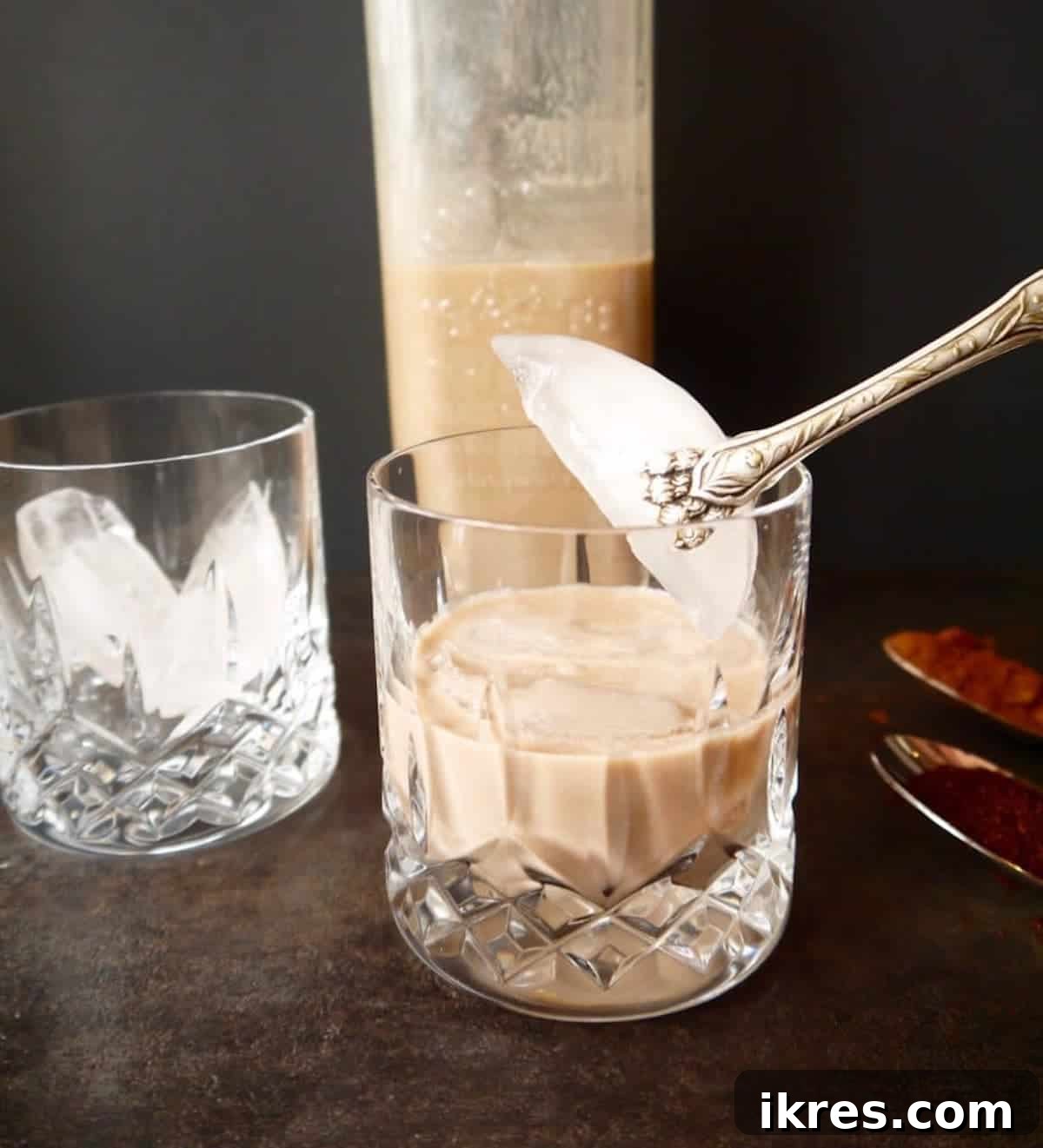 Dairy Free Irish Cream Liqueur From Scratch 3 Dairy-free Baileys being poured into a glass with ice.