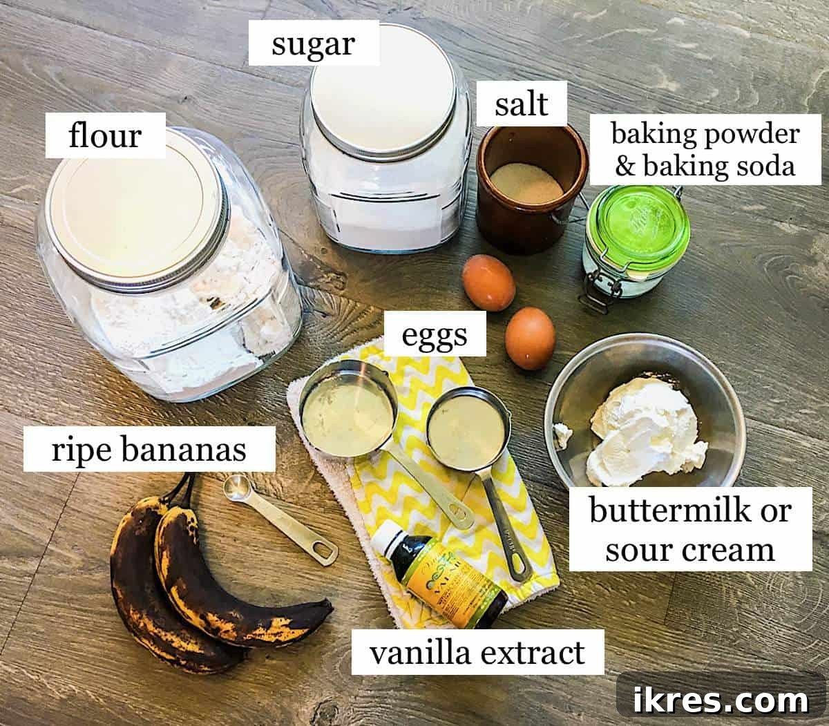 Perfectly Easy Bread Maker Banana Bread 3 A beautifully arranged selection of fresh ingredients for bread machine banana bread, including ripe bananas, butter, eggs, flour, sugar, and buttermilk, all ready for baking.