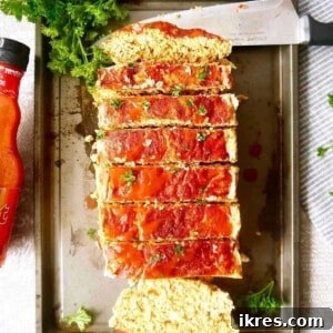 Buffalo turkey meatloaf on a pan after being sliced.