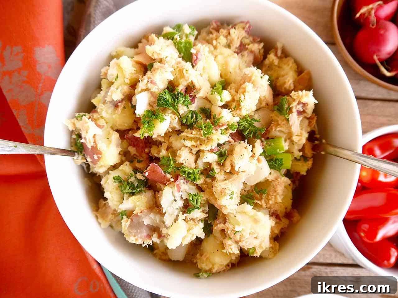 Rustic French Tuna Potato Salad 2 A large bowl of fresh French tuna potato salad, beautifully garnished and ready to serve, highlighting its vibrant ingredients.