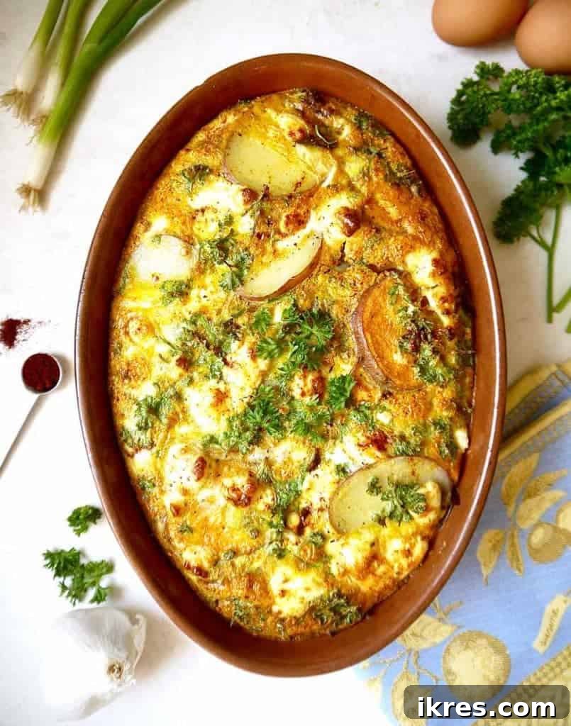 Close-up of golden Paleo Baked Spanish Tortilla with fresh herbs
