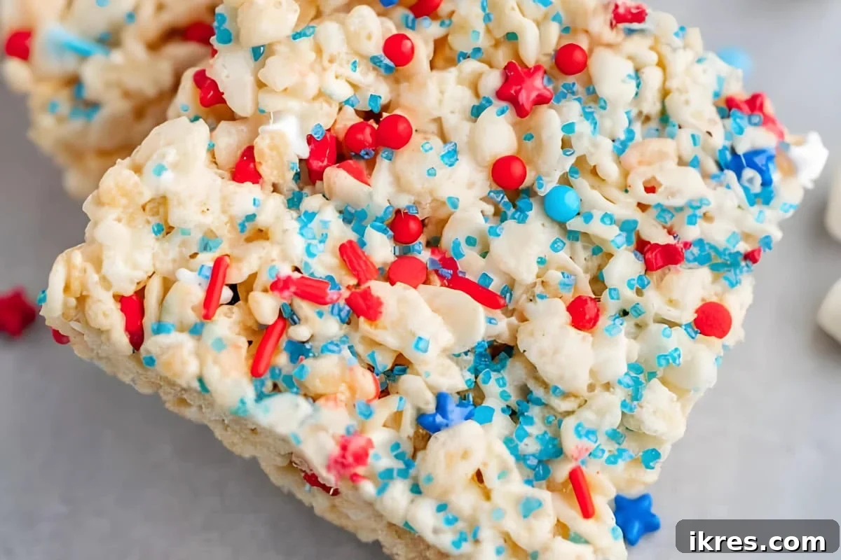 Stars and Stripes Krispie Treats: The Ultimate Patriotic Party Snack 3 Red, White, and Blue Rice Krispie Treats with patriotic sprinkles