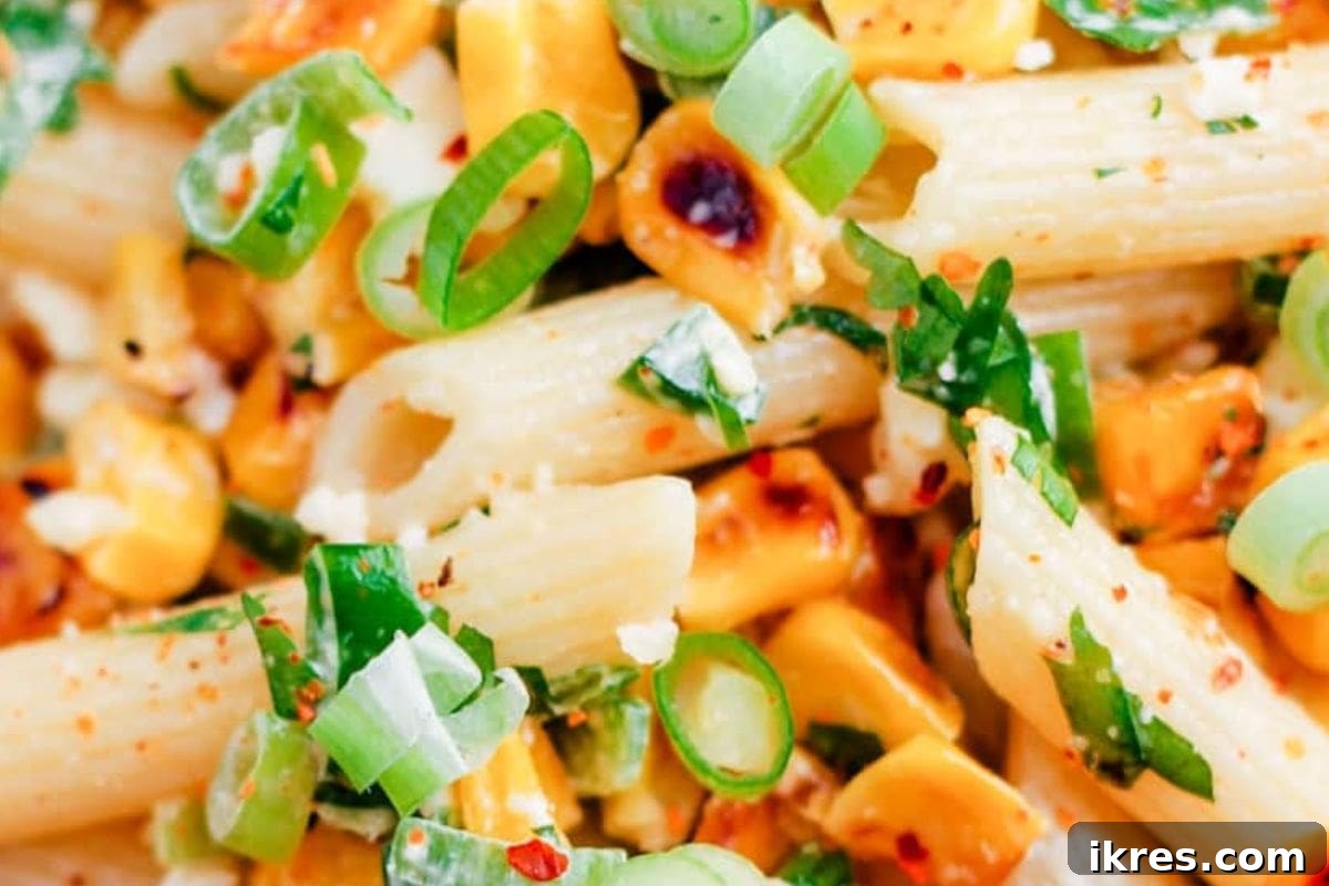 Mexican Street Corn Pasta Salad with charred corn, cotija cheese, and chili lime dressing