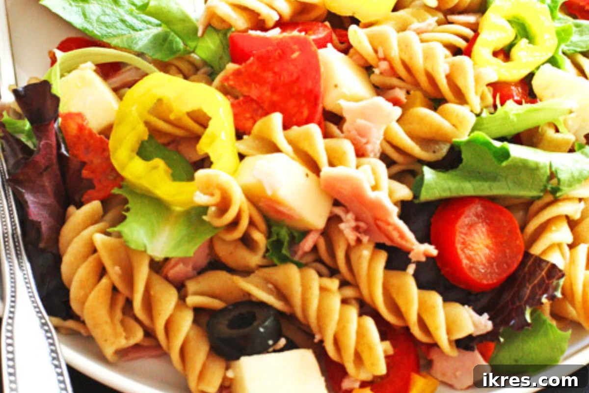 Antipasto Pasta Salad with cured meats, cheeses, peppers, and balsamic vinaigrette