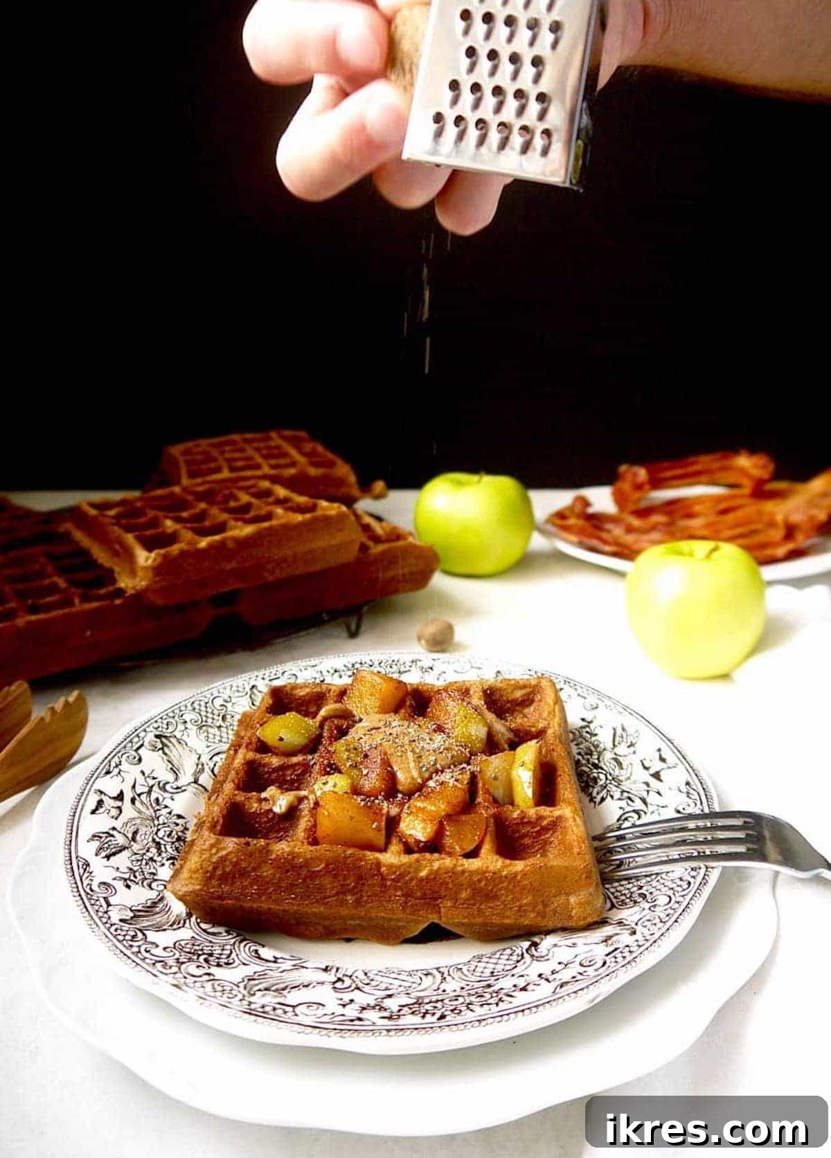 Paleo Gluten-Free Apple Cinnamon Waffles 7 Healthy apple waffles being garnished with freshly grated nutmeg.