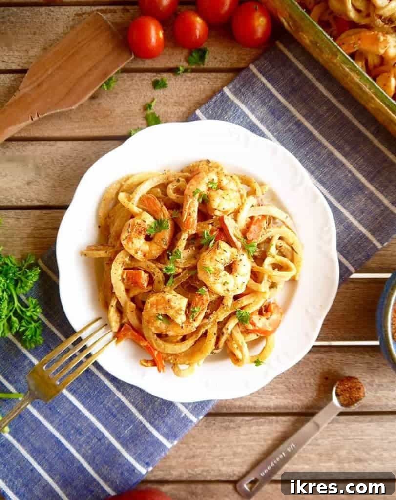 Zesty Cajun Shrimp & Potato Noodle Bake 5 Detailed shot of spiralized potatoes being prepared for a Cajun casserole