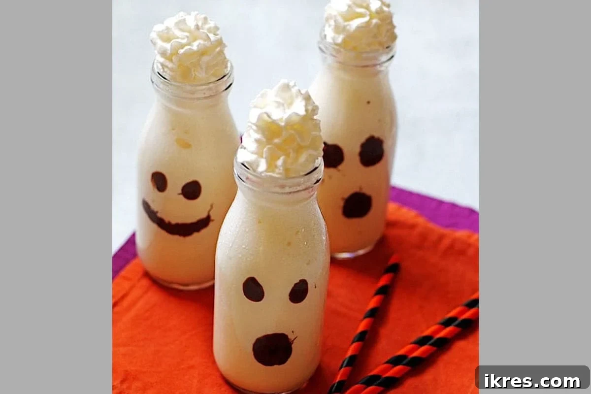 Adorable Halloween Ghost Milkshakes, a sweet and spooky vanilla treat for kids and parties