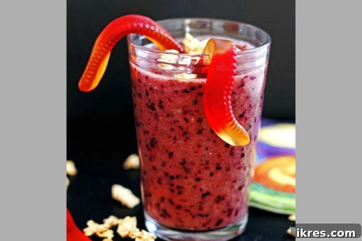 Healthy and fun Purple People Eater Smoothie, a nutritious and spooky drink for Halloween