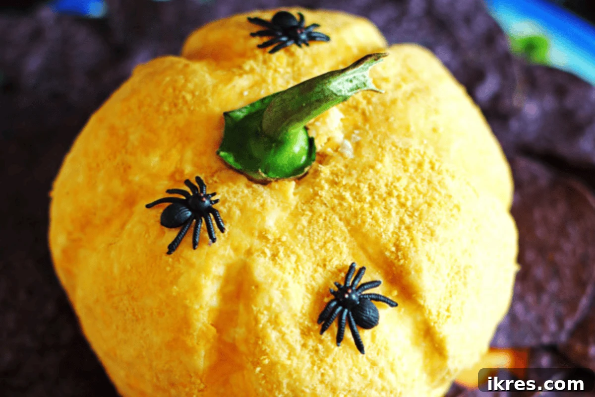 Festive Pumpkin Shaped Cheese Ball, a delicious and cheesy appetizer for Fall and Halloween parties