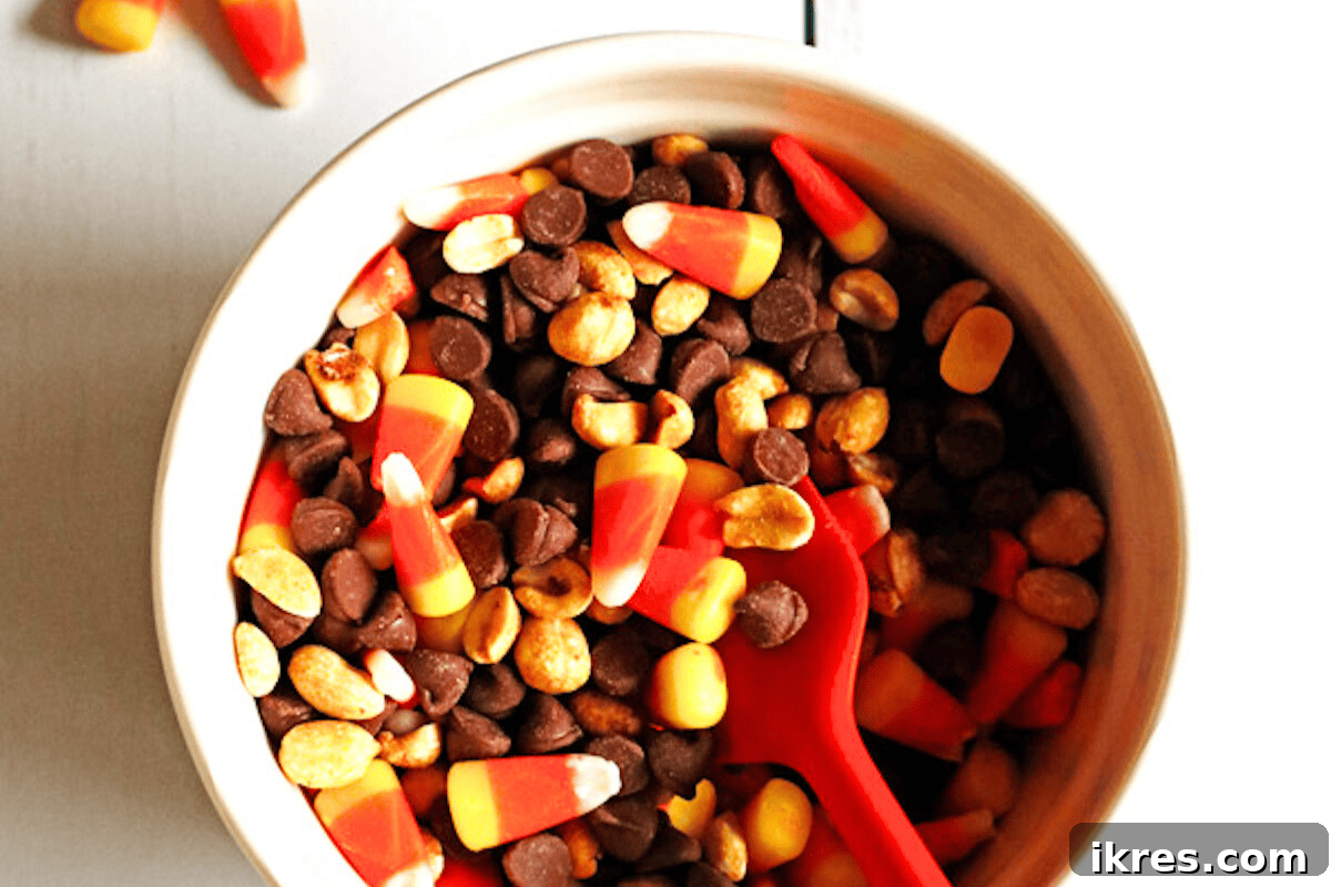 Easy and delicious Candy Corn Snack Mix with salty peanuts, perfect for Fall and Halloween