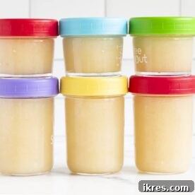 Homemade applesauce in a container, ready for storage.
