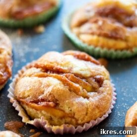 Deliciously gooey cinnamon apple muffins, freshly baked.
