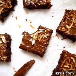 A bite taken out of a Gluten-free Toasted Coconut Brownie.