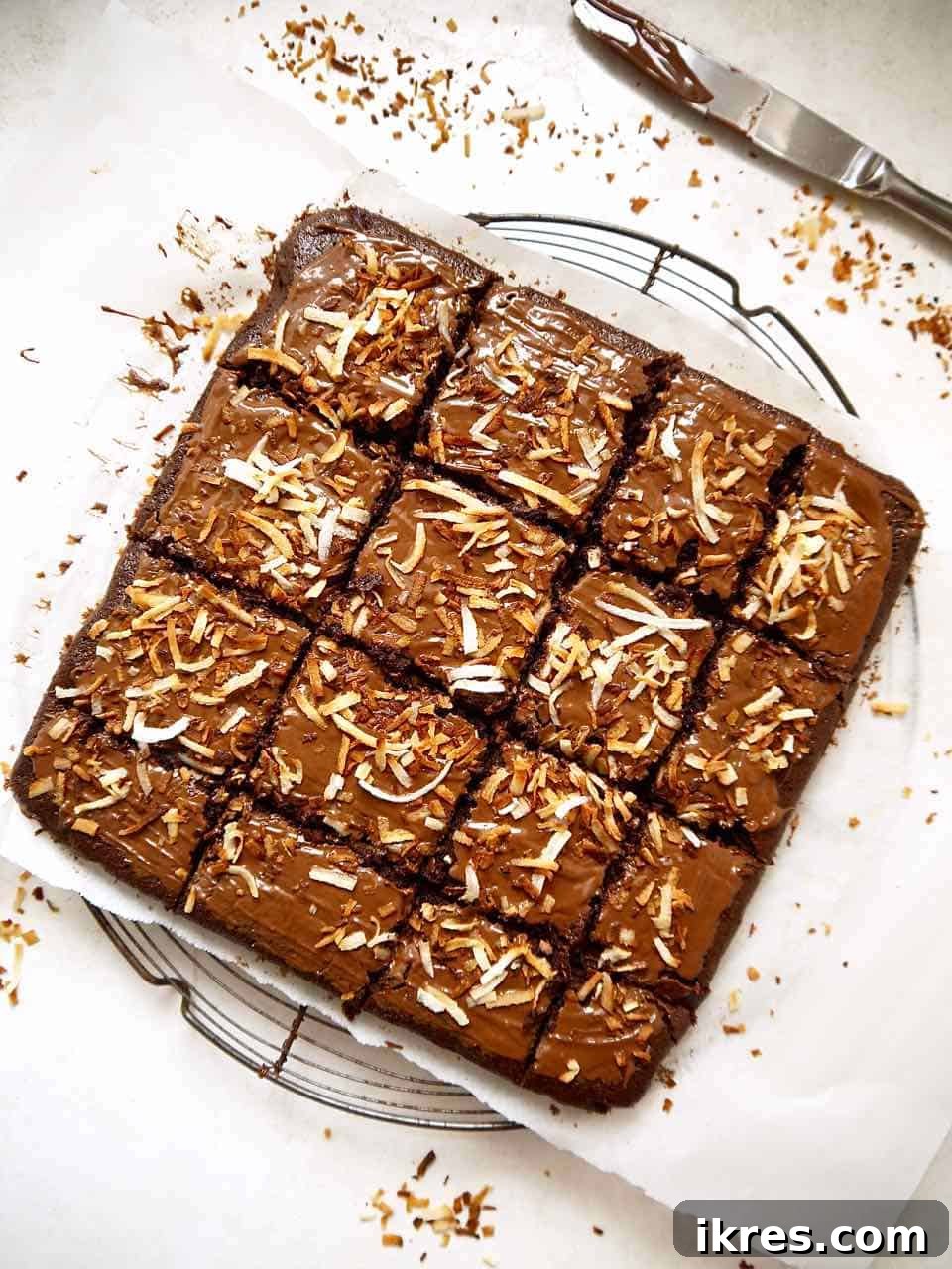 Gluten-Free Toasted Coconut Cloud Brownies 9 Perfectly sliced coconut brownies arranged on a cooling rack, ready to be enjoyed.