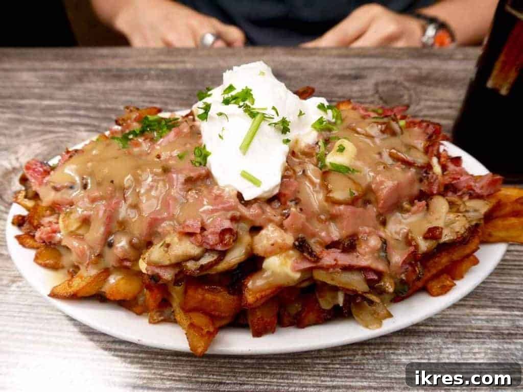 Quebec Destinations Montreal Baie St Paul La Malbaie 22 Asterix Poutine: A Hearty Blend of Mushroom Gravy, Smoked Meat, and Sour Cream