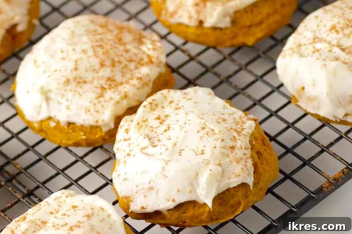 Decadent pumpkin cookies with rich cream cheese frosting, perfect for Thanksgiving