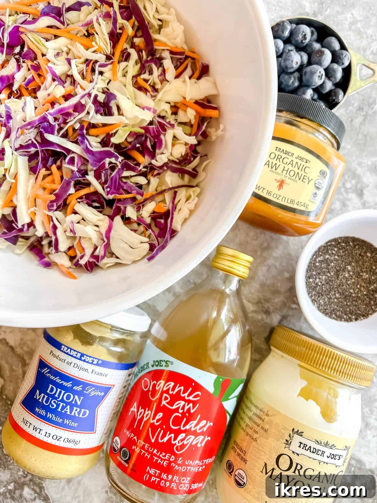 Paleo Berry Chia Slaw: A Dairy-Free Superfood Twist 3 Ingredients needed to make healthy blueberry coleslaw.