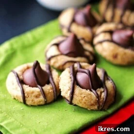 Peanut Butter Kiss Cookies on green and red napkins, a delicious Christmas cookie recipe.