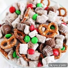 Christmas Reindeer Chow with Chex, peanut butter, chocolate, and holiday M&M's, a quick and festive snack mix.