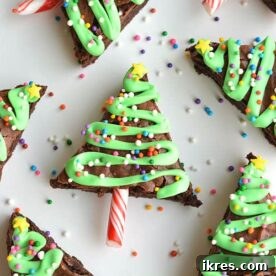 Festive Christmas Tree Brownie Bites decorated with green frosting and colorful sprinkles, perfect for a fun holiday dessert.