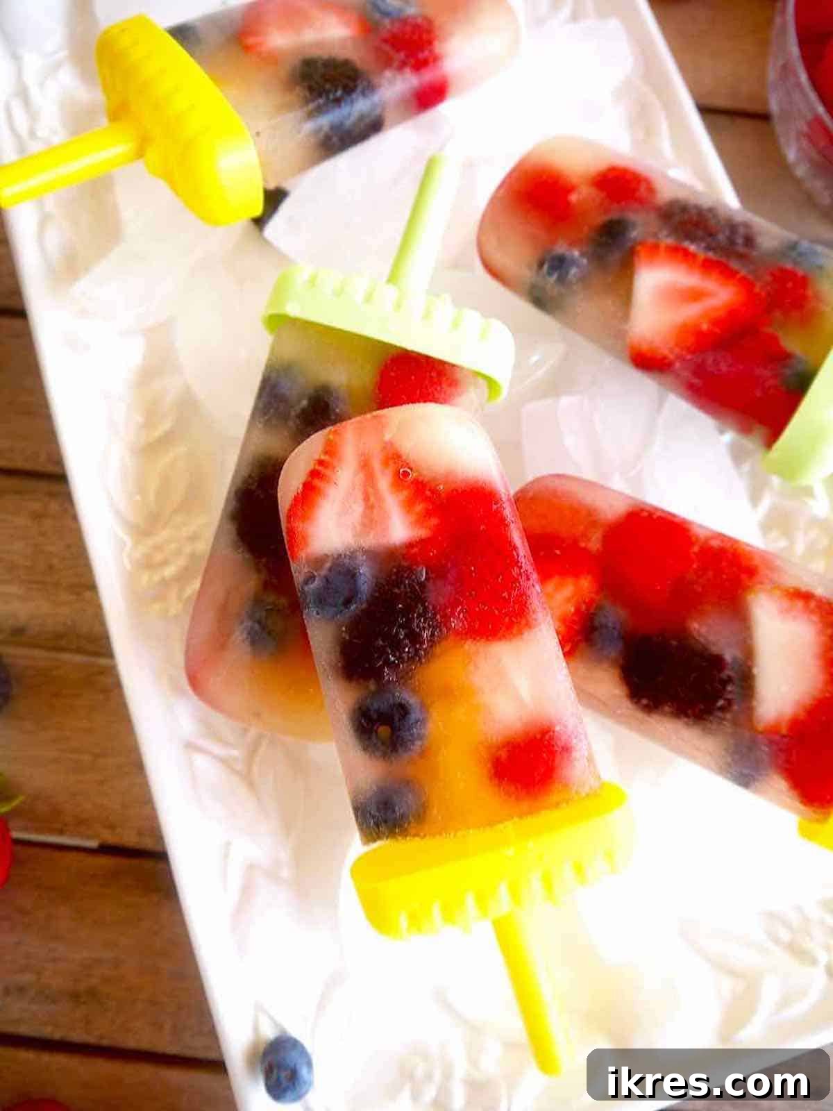 A tray of apple juice popsicles perfectly frozen and ready to be enjoyed.