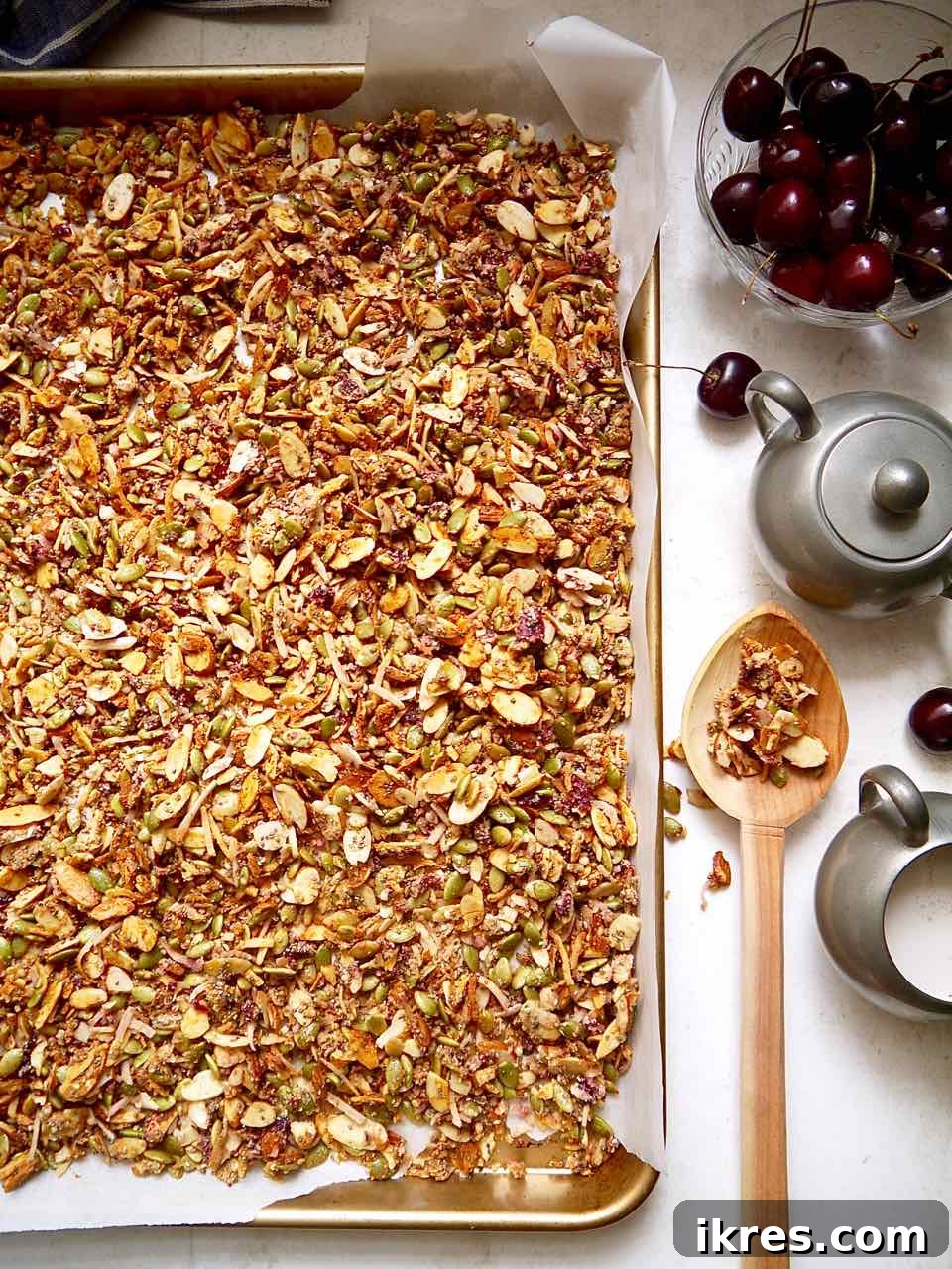 Irresistible Grain-Free Cherry Granola 4 Cherry granola spread evenly on a baking pan, ready for the oven.