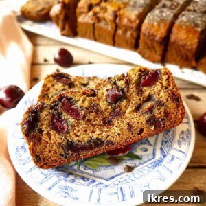 Pure Paleo Cherry Banana Loaf 6 Gluten Free Cherry Banana bread with chocolate chips on a plate.
