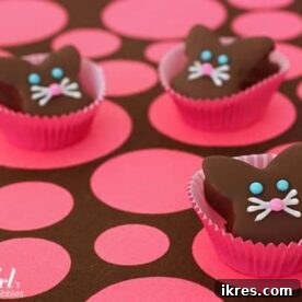 Adorable Chocolate Coated Marshmallow Bunnies, crafted from homemade marshmallows and generously coated in a rich chocolate sauce, presented as a sweet Easter treat.