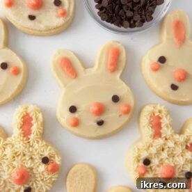 Easy Easter Bunny Sugar Cookies, requiring no fancy decorating skills, made with a favorite cut-out sugar cookie recipe and simply topped with mini chocolate chips and dots of pink frosting.
