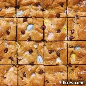 Easter Blondies, described as gooey, chewy, and loaded with mini Cadbury eggs, presented as an easy, one-bowl Easter dessert requiring no mixer.