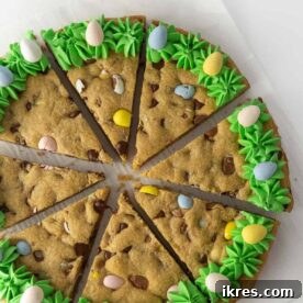 An adorable, thick, and chewy Easy Easter Cookie Cake, perfect for Easter celebrations, with a DIY foil pan hack and festive decorations.