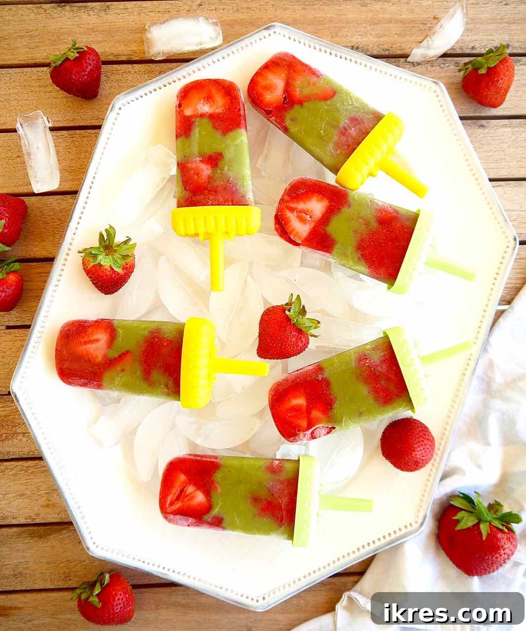 Strawberry Matcha Fusion Pops 6 Ready-to-eat Strawberry Matcha Popsicles after being frozen, showcasing their vibrant colors.
