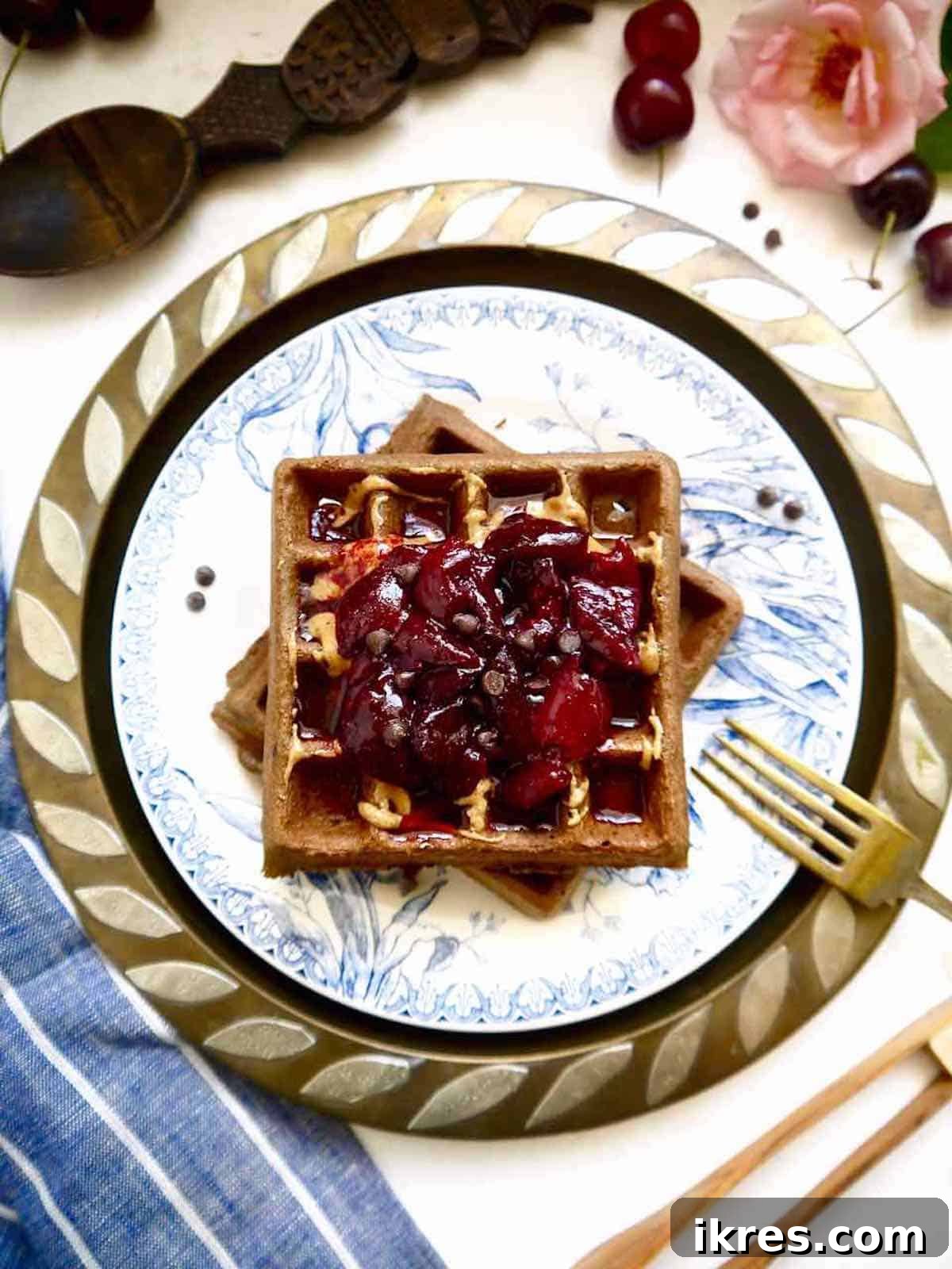 Decadent Grain-Free Chocolate Cherry Waffles 3 Gluten free chocolate waffles with cherry compote on top.