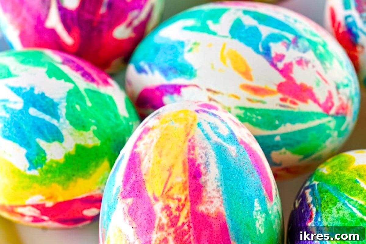 Vibrantly colored Tie Dye Easter Eggs displayed on a white surface, showcasing unique marbled patterns.