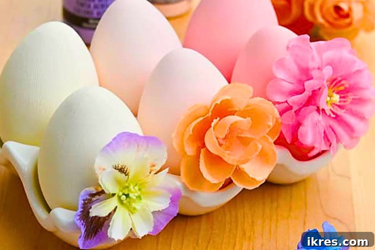 Delicate Floral Easter Eggs adorned with small fabric flowers and pastel paint.