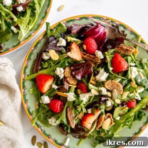 Close-up of a vibrant Berry and Fig Salad with Goat Cheese and Vanilla Vinaigrette, showcasing its fresh ingredients.