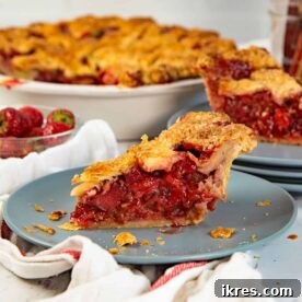 A delicious Strawberry Rhubarb Pie with a flaky crust and thick filling.
