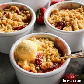 Strawberry Rhubarb Crumble in individual ramekins, with a crispy topping.