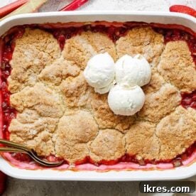 A warm Strawberry Rhubarb Cobbler with a tender biscuit topping.