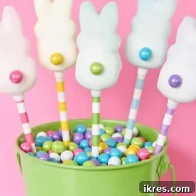 Close-up of adorable Easter Peeps Pops, featuring colorful marshmallow chicks on sticks, decorated with sprinkles.