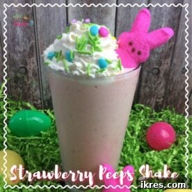 A tall glass of Strawberry Peep Milkshake, garnished with whipped cream and a pink Peep, ready for enjoyment.