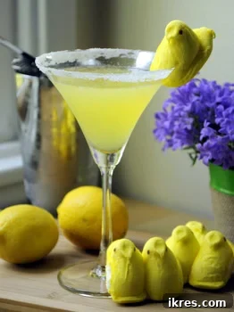 A vibrant Peep Vodka Lemon Drop cocktail, garnished with a marshmallow chick Peep, ready for a refreshing sip.