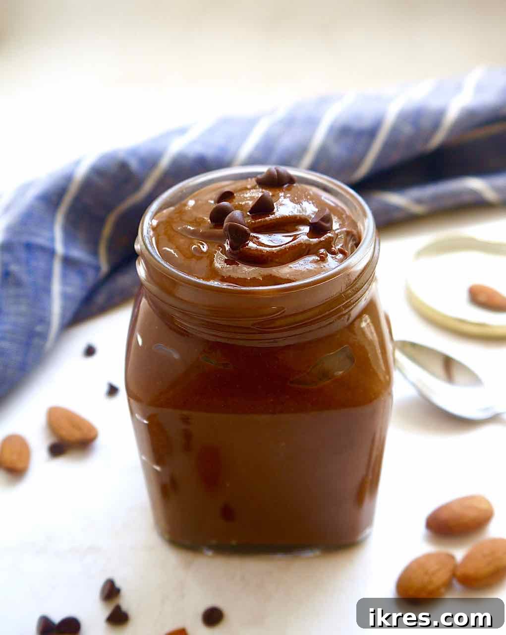 Velvety Paleo Chocolate Almond Butter 3 Homemade Paleo Chocolate Almond Butter on a spoon, illustrating perfect texture