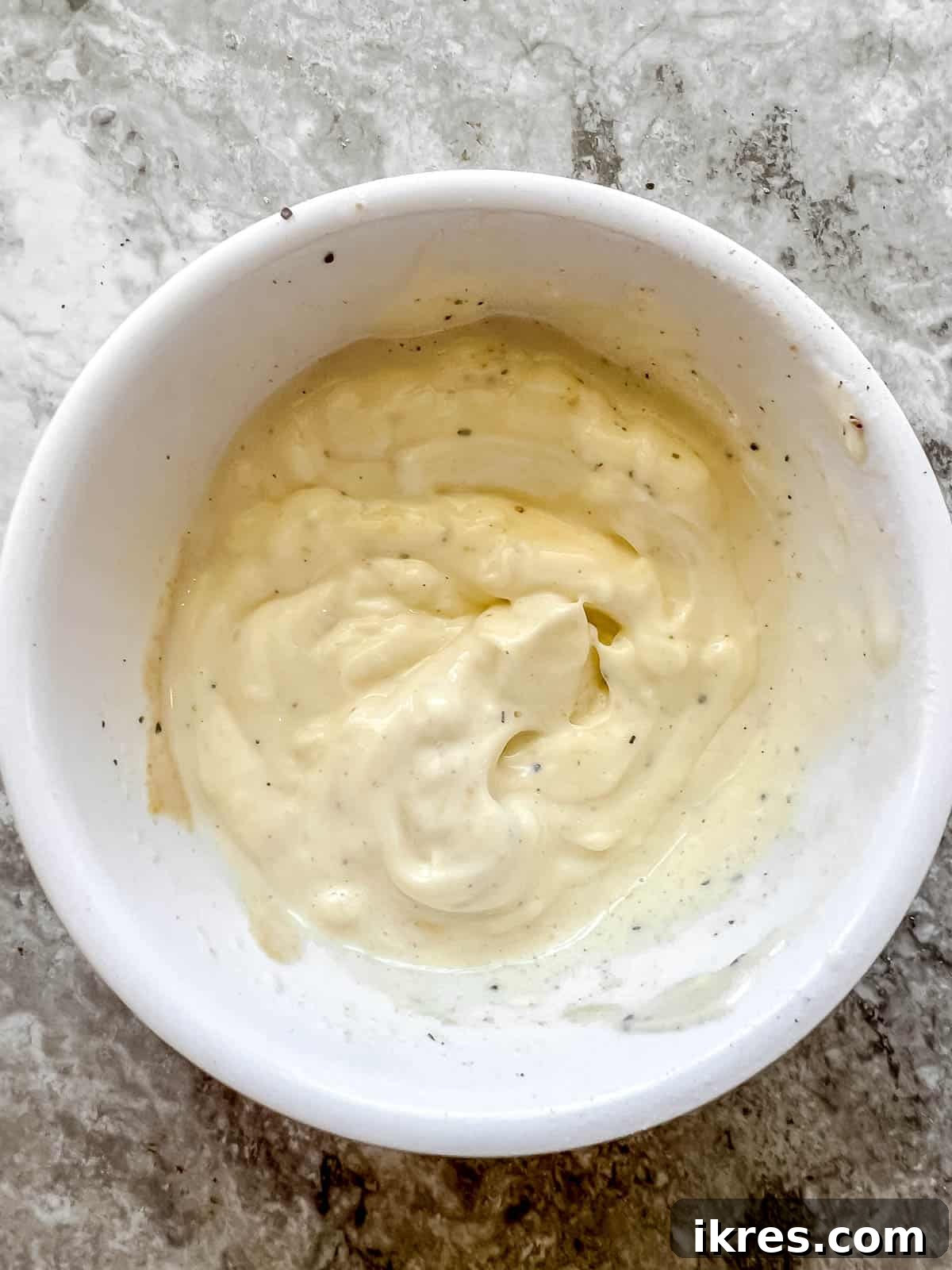 Speedy Rotisserie Chicken Salad Lettuce Cups 5 Mayonnaise sauce in a bowl, showing the creamy dressing being prepared.