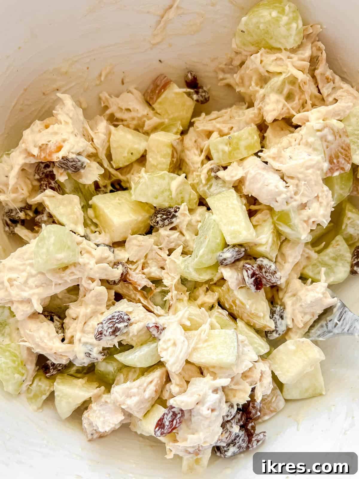Speedy Rotisserie Chicken Salad Lettuce Cups 7 Diced apples, raisins, and grapes added to the chicken salad mixture, ready for the final mix.